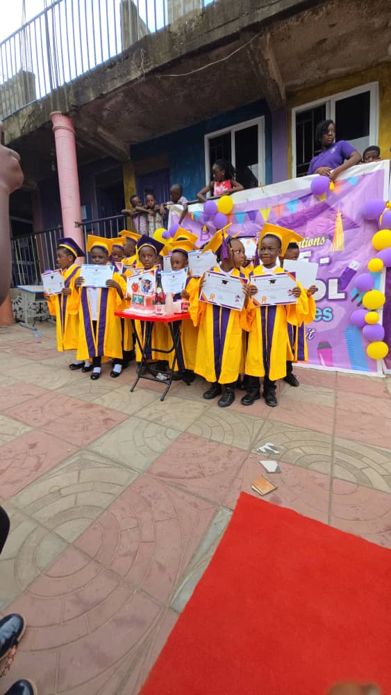 Pupils in graduation gowns lined up for the ceremony