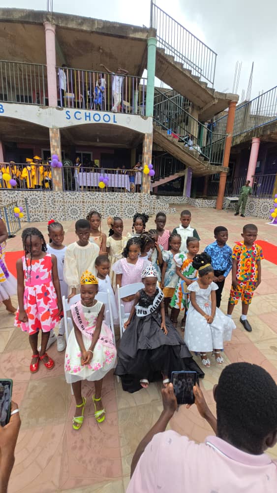 Families photographing pupils during a school celebration